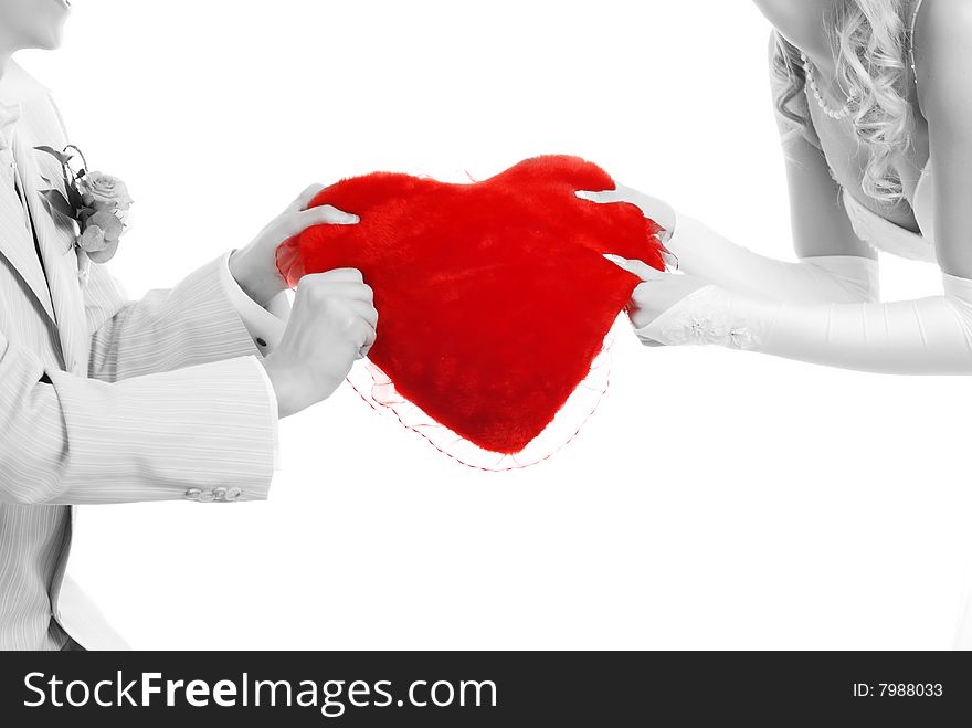 Picture of loving couple with red heart in their hands