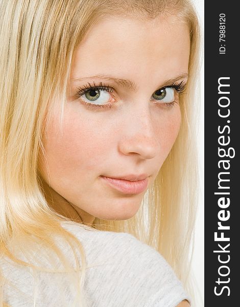 Pretty blonde woman looking seductively close up isolated over white