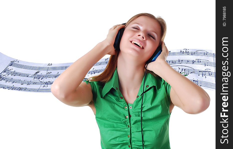 Young beautiful woman listening music with headpfones. Young beautiful woman listening music with headpfones
