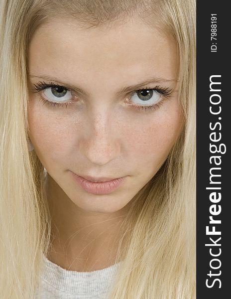 Pretty blonde woman looking seductively close up isolated over white