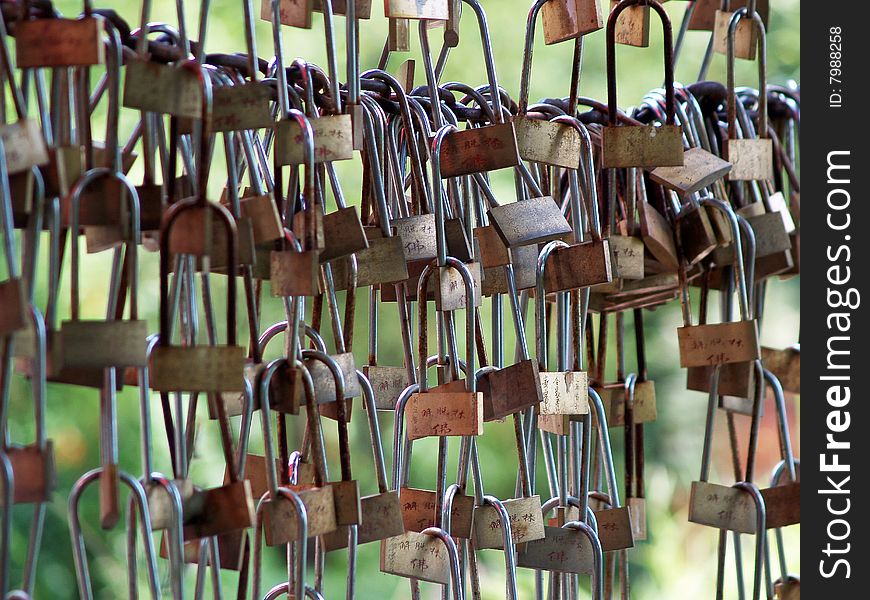 A bunch of locks tied to each other, put there by numerous couples...Lijiang, China. A bunch of locks tied to each other, put there by numerous couples...Lijiang, China.