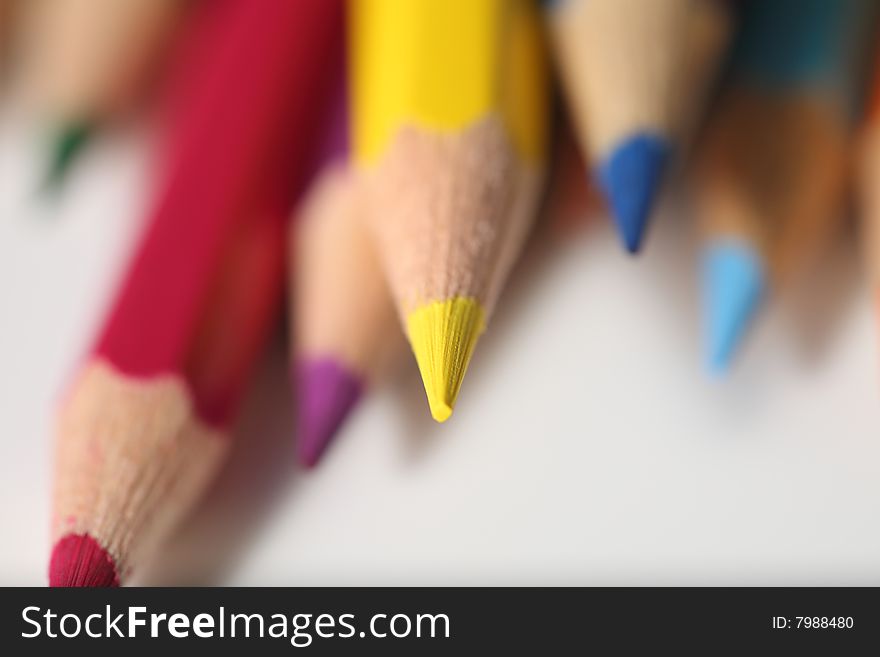 Macro pencil cluster yellow focus on white background. Macro pencil cluster yellow focus on white background