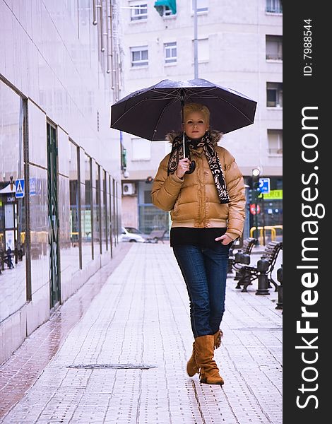 Young blond woman in a rainy day. Young blond woman in a rainy day.