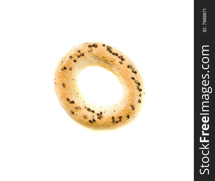 Ring biscuit with poppyseed on white ground