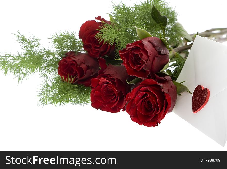 Red roses with envelope and heart, as a present on mothers day or Valentines day