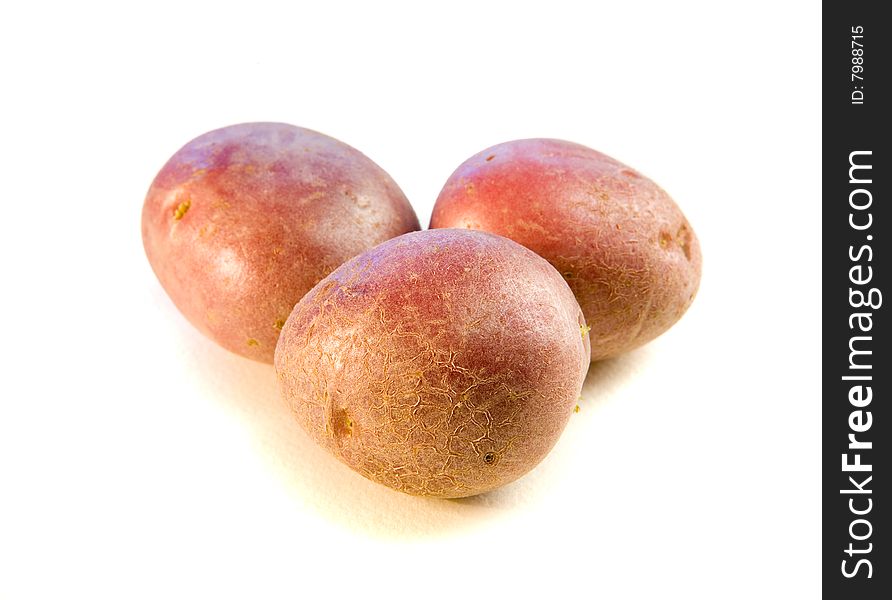 Tree potatoes on white ground