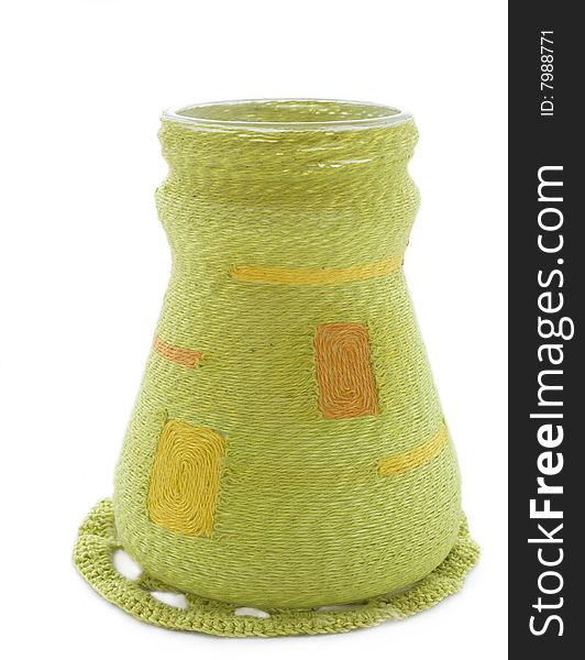 Vase in the knitted cloth on a white background