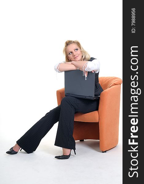 Woman with a notebook on a orange couche