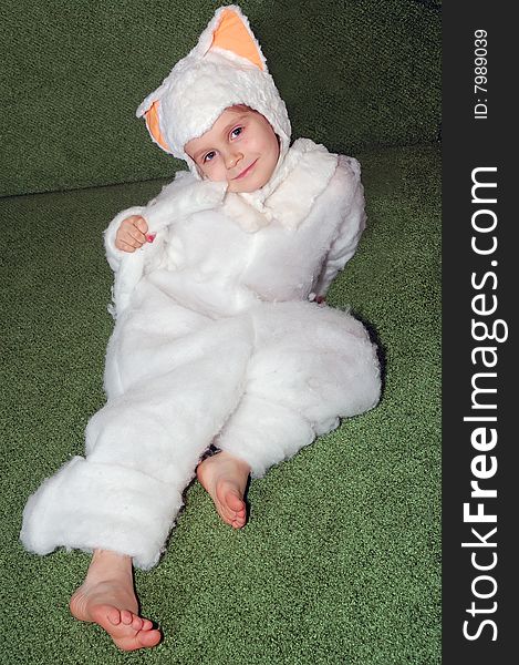 Little girl wearing a white kitten costume. Little girl wearing a white kitten costume