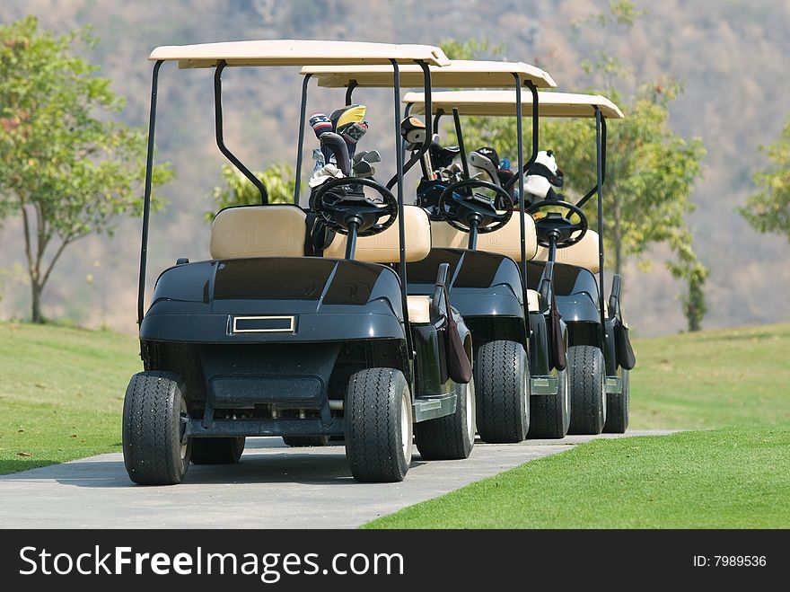 Three golf cars