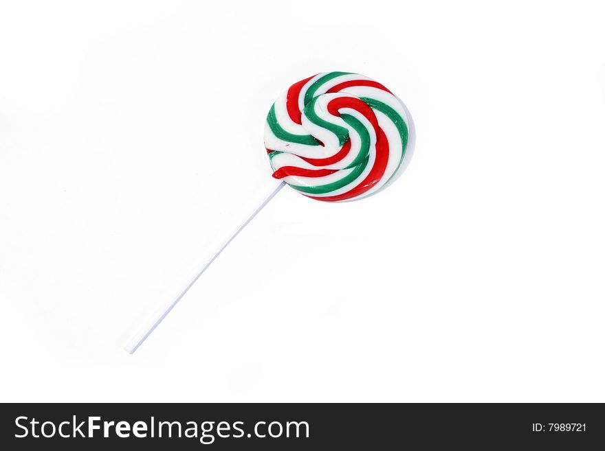 One single handmade lollipop on a white background. One single handmade lollipop on a white background.