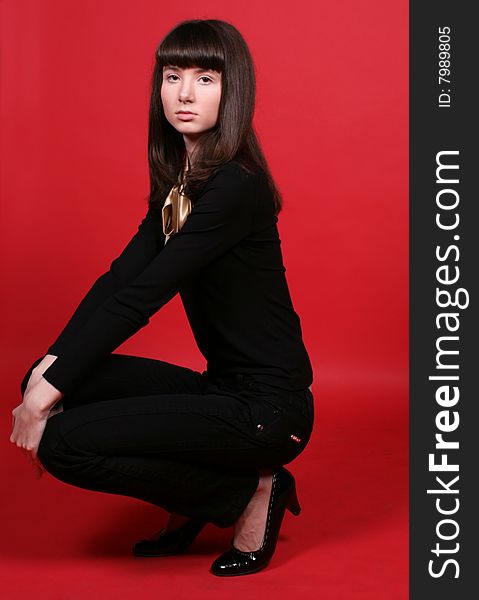 A Girl Squating In Studio