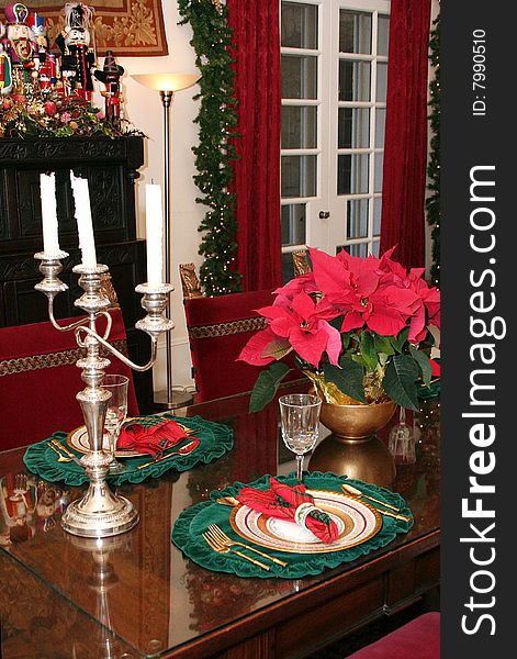 A table is ornately decorated for Christmas. A table is ornately decorated for Christmas.