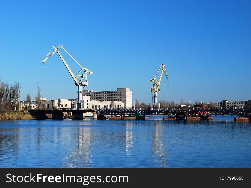 Cargo cranes in industrial sea port