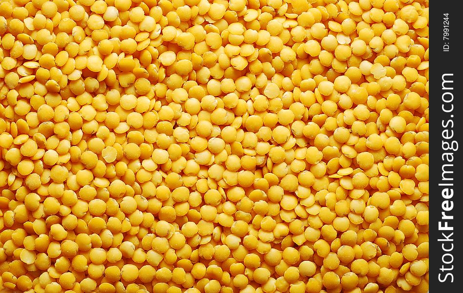 Yellow lentil background. food background