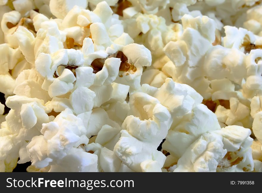 Scattered flakes of salty popcorn. Photo close-up