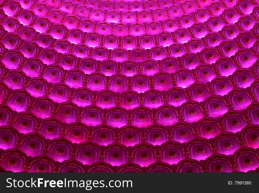 A ceiling of a hall decorated by lots of colorful lights. A ceiling of a hall decorated by lots of colorful lights