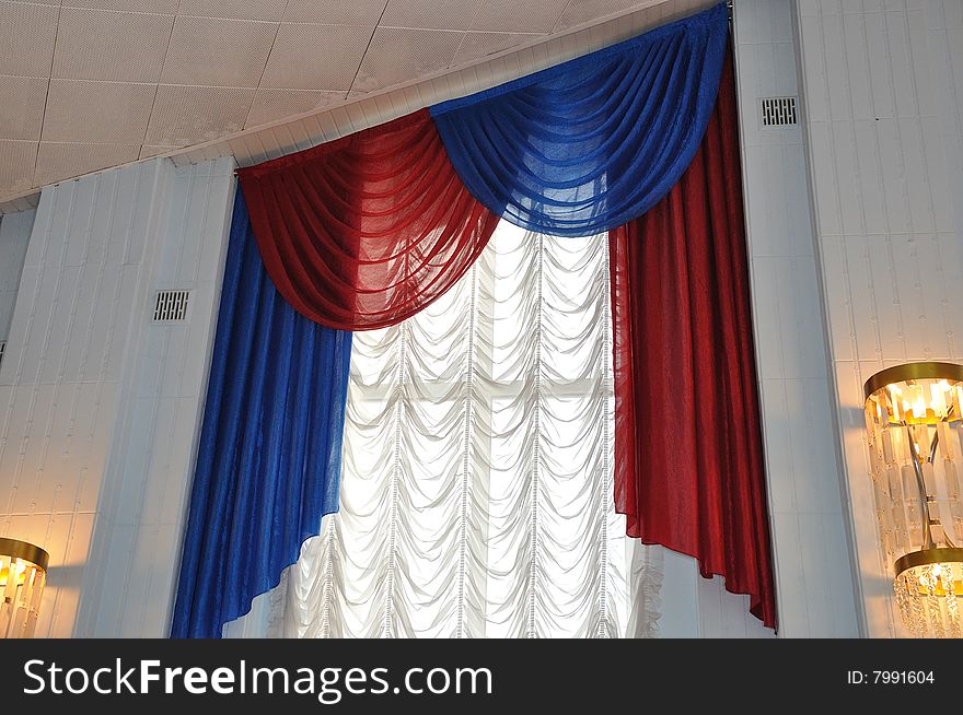 Red and blue rippled textile curtain