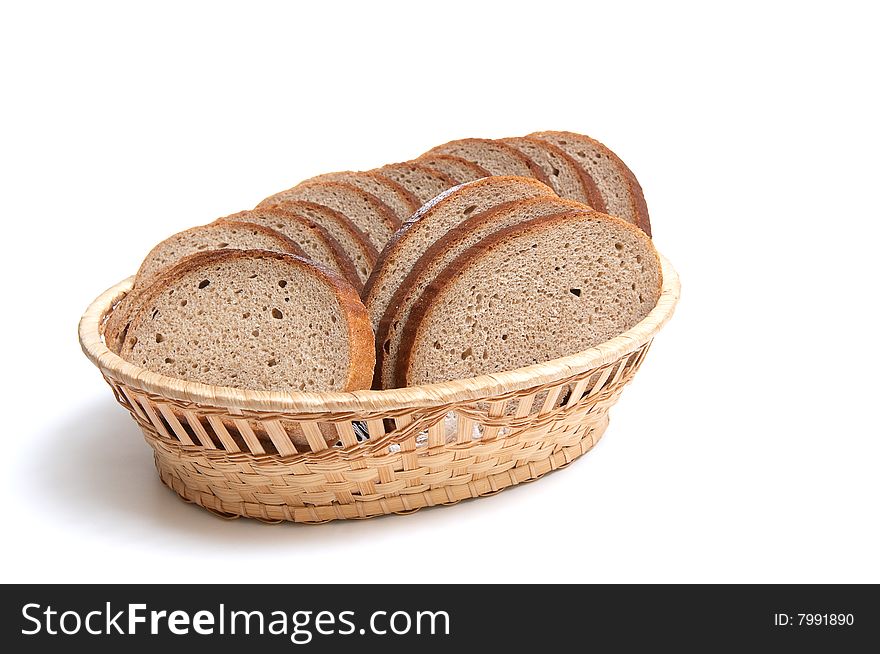 Pieces of bread in the basket isolated on a white background. Pieces of bread in the basket isolated on a white background.