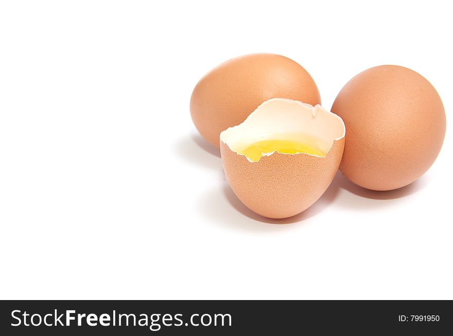 Broken egg and yolk isolated on a white background. Broken egg and yolk isolated on a white background.