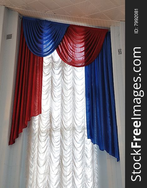 Red and blue rippled textile curtain