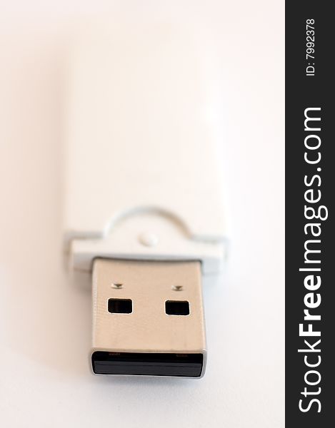 USB key detail photo, distance blur, white to pink background