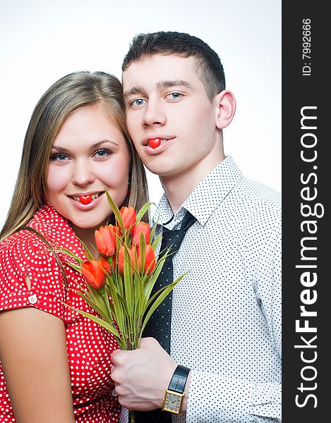 Happy couple with heart-shaped candies