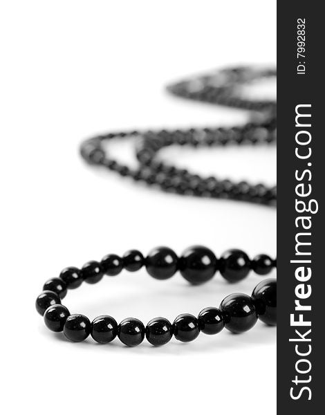 Black necklace on a white background