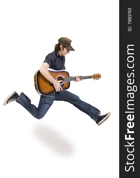 Passionate guitarist jumps on white background
