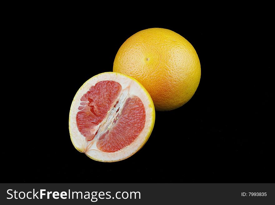 Orange fruit isolated on black