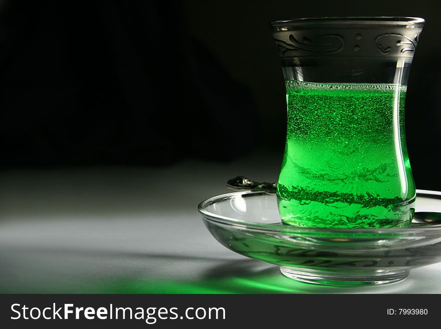 Turkish glass with a green tea