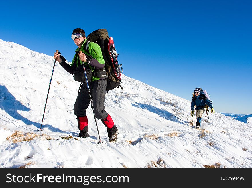 Hiker are in winter in mountains