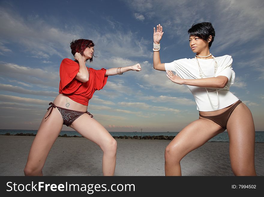 Woman on the beach fighting. Woman on the beach fighting