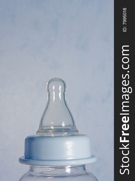 Shoot of an baby bottle with its teat on it. Shoot of an baby bottle with its teat on it