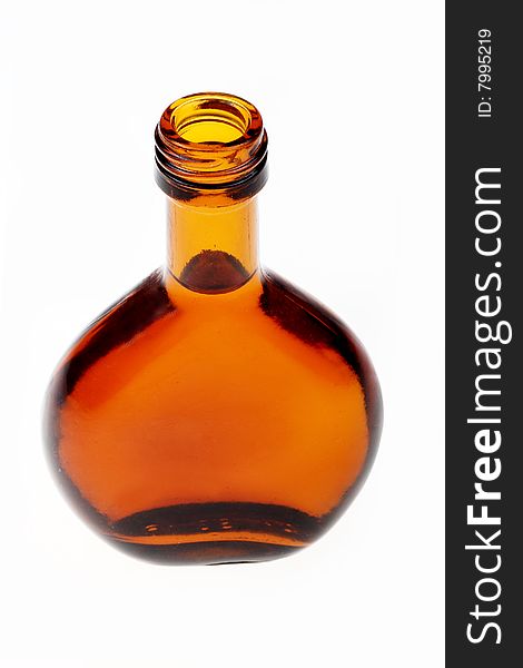 Whiskey bottle opened against white background.