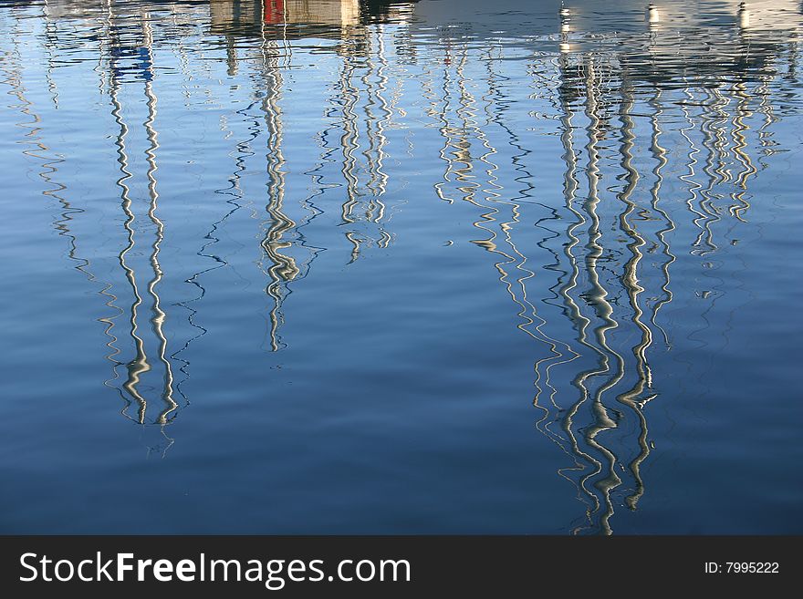 Sails reflected on the sea. Sails reflected on the sea