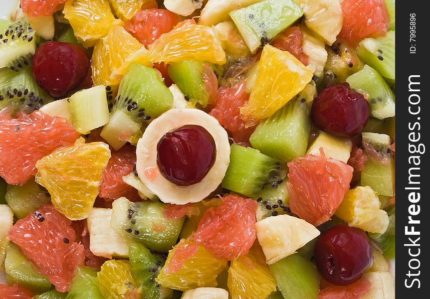 Colorful fruit salad close-up. Colorful fruit salad close-up