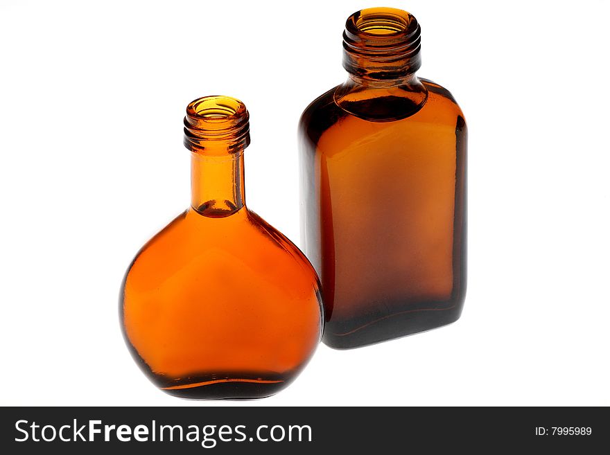 Whiskey bottles of different shapes in white background