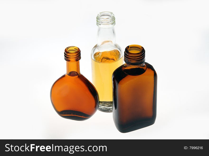 Whiskey bottles of different shapes in white background