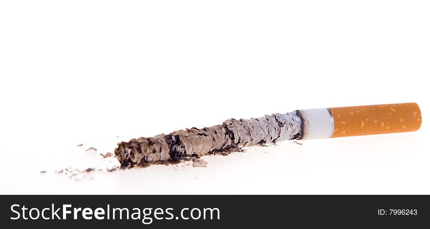 Cigarettes, which was burnt down, on white background, with the ashes that are scattered. Cigarettes, which was burnt down, on white background, with the ashes that are scattered