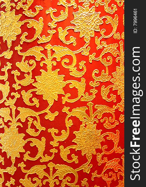 Closeup golden Chinese mosaic with red background