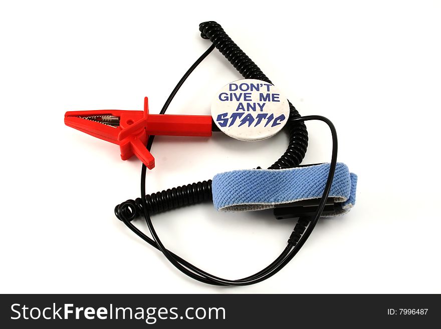 Electrostatic discharge wrist strap and static pin on white background.