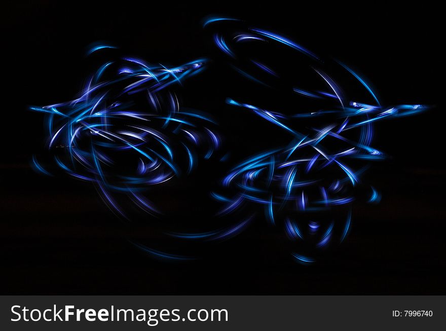 Streaming neon light shapes in the dark. Streaming neon light shapes in the dark