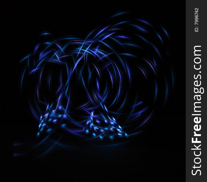 Streaming neon light shapes in the dark. Streaming neon light shapes in the dark