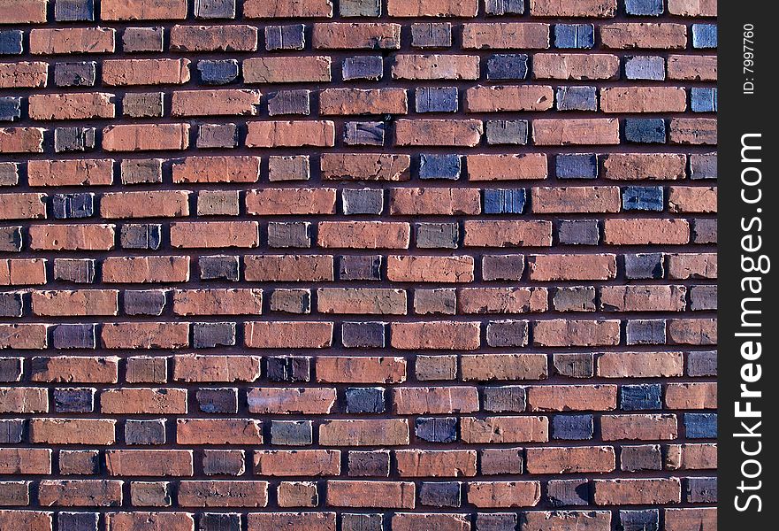 Multi-colored and duo-sized, old exterior brick wall. Multi-colored and duo-sized, old exterior brick wall.