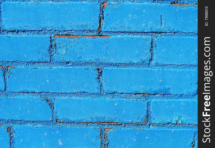 Blue paint on bricks make a nice display of texture and color on a city wall. Blue paint on bricks make a nice display of texture and color on a city wall.