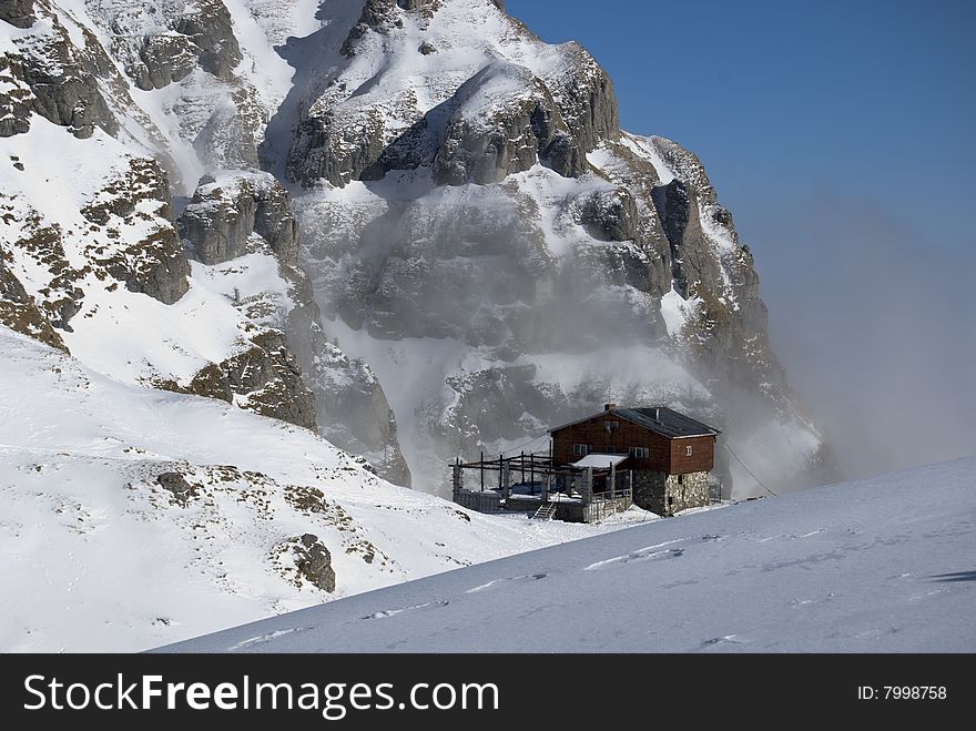 Mountain hut in winter,in Bucegi mountains,Romania