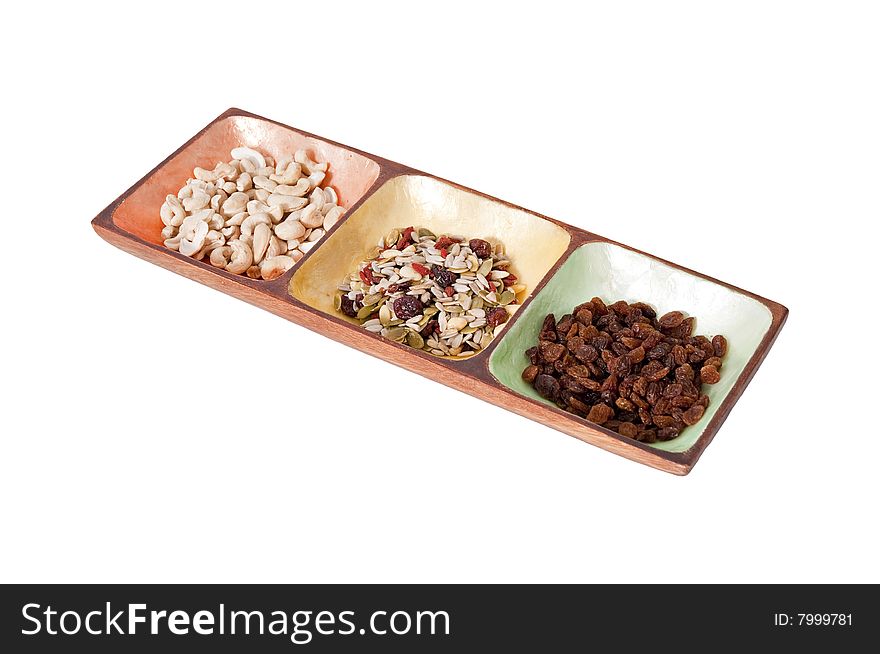 Healthy snack food in a colorfull serving bowl isolated against a white background. Healthy snack food in a colorfull serving bowl isolated against a white background.