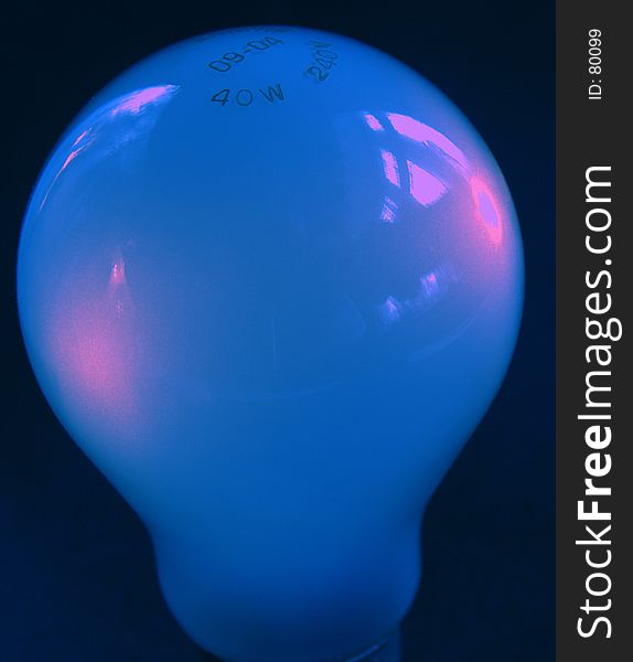 Blue light bulb against a black background