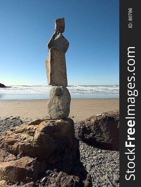 Rocks stacked at the beach near Cannon Beach, Oregon. Religous idol or bored kids?. Rocks stacked at the beach near Cannon Beach, Oregon. Religous idol or bored kids?